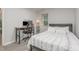 Bright bedroom with natural light, minimalist decor, and sleek desk for a functional space at 101 Oyster Bay Ct # B2, Cary, NC 27513