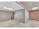 An entryway with exposed brick wall and neutral wall planks at 101 Oyster Bay Ct # B2, Cary, NC 27513