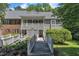 Charming condo with wood bridges leading to a covered porch entry and second story balcony at 101 Oyster Bay Ct # B2, Cary, NC 27513
