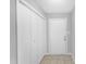A hallway with white closet and entry door at 101 Oyster Bay Ct # B2, Cary, NC 27513