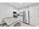 Bright kitchen with white cabinets, stainless steel appliances and a grey granite countertop at 101 Oyster Bay Ct # B2, Cary, NC 27513