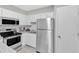 Bright kitchen with white cabinets and stainless steel appliances at 101 Oyster Bay Ct # B2, Cary, NC 27513
