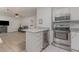 This spacious kitchen features stainless steel appliances, a granite countertop bar and ample lighting at 101 Oyster Bay Ct # B2, Cary, NC 27513