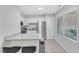 Bright kitchen with white cabinets, stainless steel appliances and a grey granite countertop at 101 Oyster Bay Ct # B2, Cary, NC 27513