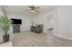 A living room features sleek modern flooring, bright light and a comfortable sitting area at 101 Oyster Bay Ct # B2, Cary, NC 27513