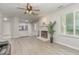A naturally bright living room features modern flooring, a fireplace, and plenty of space at 101 Oyster Bay Ct # B2, Cary, NC 27513