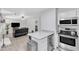Open concept living space connects the kitchen with living area featuring a fireplace at 101 Oyster Bay Ct # B2, Cary, NC 27513