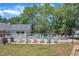 Community pool featuring lounge chairs and mature trees at 101 Oyster Bay Ct # B2, Cary, NC 27513