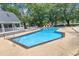Community pool with lounge chairs at 101 Oyster Bay Ct # B2, Cary, NC 27513