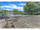 Community tennis court with mature trees at 101 Oyster Bay Ct # B2, Cary, NC 27513