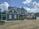 Beautiful two-story home with a front porch and a two-car garage, on a partially landscaped yard, located in a nice community at 1017 Azalea Garden Cir, Raleigh, NC 27603