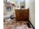 Bathroom featuring wood vanity with storage, toilet, and storage shelves at 103 N Woods Rd, Henderson, NC 27536