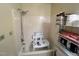 Bathroom featuring a tub and shower combo and storage shelves at 103 N Woods Rd, Henderson, NC 27536