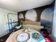 Bonus room featuring a mural, game table and ladder at 103 N Woods Rd, Henderson, NC 27536