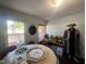 Bonus room featuring a game table, vintage costume and windows at 103 N Woods Rd, Henderson, NC 27536