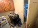 Laundry room with wood cabinets, washer, and dryer at 103 N Woods Rd, Henderson, NC 27536