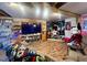 Entertainment room with a large TV, built-in shelving, and Star Wars decorations at 103 N Woods Rd, Henderson, NC 27536