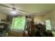 This living room has a ceiling fan and a window with lots of natural light and exterior views at 103 N Woods Rd, Henderson, NC 27536
