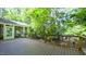 Spacious deck with wood railings offers views of the private wooded backyard at 108 Ellsworth Pl, Chapel Hill, NC 27516