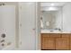 Bathroom showcasing tiled shower, wooden vanity and cabinets plus ample lighting at 108 Ellsworth Pl, Chapel Hill, NC 27516