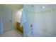 Clean bathroom featuring a vanity, mirror, and tub-shower combination at 108 Ellsworth Pl, Chapel Hill, NC 27516