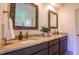 Granite countertop in bathroom featuring dual sinks and decorative mirrors at 108 Ellsworth Pl, Chapel Hill, NC 27516