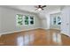 Spacious bedroom with hardwood floors and ample natural light from the large windows at 108 Ellsworth Pl, Chapel Hill, NC 27516