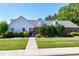 Attractive clubhouse with manicured lawn and walkway leading to a gated entrance under an archway at 108 Ellsworth Pl, Chapel Hill, NC 27516