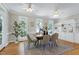 Sunlit dining area with hardwood floors and built-in shelving creates a welcoming atmosphere at 108 Ellsworth Pl, Chapel Hill, NC 27516