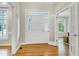 Bright foyer with hardwood floors, front door, and glass-paned doors to another room at 108 Ellsworth Pl, Chapel Hill, NC 27516