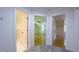 Hallway with open doorways to a bathroom and bedrooms at 108 Ellsworth Pl, Chapel Hill, NC 27516