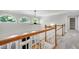Open hallway with a view of the bright living room and staircase at 108 Ellsworth Pl, Chapel Hill, NC 27516
