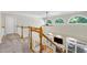 Hallway featuring view of the bright living room and staircase at 108 Ellsworth Pl, Chapel Hill, NC 27516