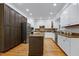 The modern kitchen features custom island, stainless appliances and plenty of cabinet space at 108 Ellsworth Pl, Chapel Hill, NC 27516