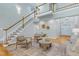Living room with a staircase, hardwood floors, neutral decor and two-story ceiling at 108 Ellsworth Pl, Chapel Hill, NC 27516