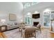 Bright living room with high ceilings, a fireplace, and large windows offering great natural light at 108 Ellsworth Pl, Chapel Hill, NC 27516