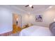 Bright bedroom with a tray ceiling, artwork, chair and a view to other rooms at 108 Ellsworth Pl, Chapel Hill, NC 27516
