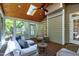 Relaxing sunroom with wood ceiling, lots of natural light and comfortable seating at 108 Ellsworth Pl, Chapel Hill, NC 27516