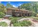 Spacious backyard featuring a multi-level deck, jacuzzi, firepit and landscaping at 10909 Raven Rock Dr, Raleigh, NC 27614