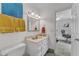 Bathroom featuring bright natural light, vanity with sink, tile floors, and acces to another room at 10909 Raven Rock Dr, Raleigh, NC 27614