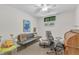 A functional bedroom with a desk, sofa, and modern chair that offers a quiet space for relaxation or study at 10909 Raven Rock Dr, Raleigh, NC 27614