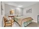 Cozy bedroom with stylish furnishings, including an armchair and unique wall decorations at 10909 Raven Rock Dr, Raleigh, NC 27614