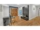 Bright foyer featuring hardwood floors, double entry doors, and stylish decorative accents at 10909 Raven Rock Dr, Raleigh, NC 27614