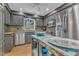 A well-equipped kitchen boasting stainless steel appliances, granite countertops, and a center island at 10909 Raven Rock Dr, Raleigh, NC 27614