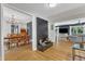 Open-concept living space with hardwood floors, stylish decor, and seamless flow to the dining area at 10909 Raven Rock Dr, Raleigh, NC 27614