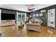 Cozy living room with hardwood floors, stylish furnishings, a ceiling fan, and natural light at 10909 Raven Rock Dr, Raleigh, NC 27614
