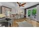 A seating area with hardwood floors, natural light, and comfortable furniture at 10909 Raven Rock Dr, Raleigh, NC 27614
