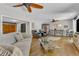 A spacious living room features hardwood floors, ample seating, and an open layout at 10909 Raven Rock Dr, Raleigh, NC 27614
