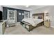 The primary bedroom offers neutral tones, cozy carpet, and a calming atmosphere at 10909 Raven Rock Dr, Raleigh, NC 27614