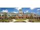 Impressive clubhouse with stone accents, a clock tower, and lush landscaping at 113 Dowington Ln, Cary, NC 27519